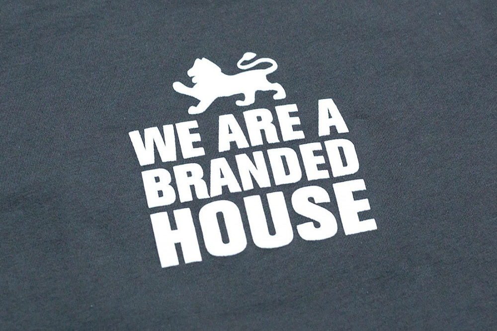 "We are a branded house" t-shirt text
